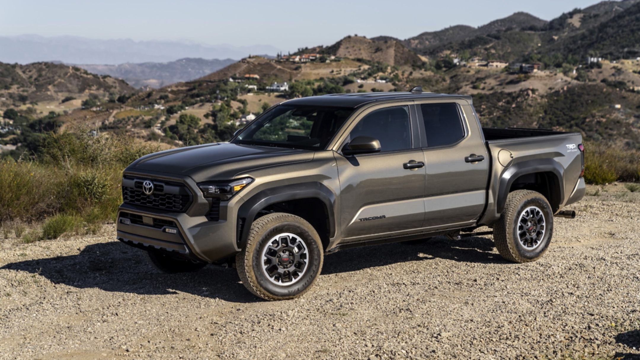 2025 Toyota Tacoma TRD Off-Road photographed on a hilltop overlook, front three-quarter view